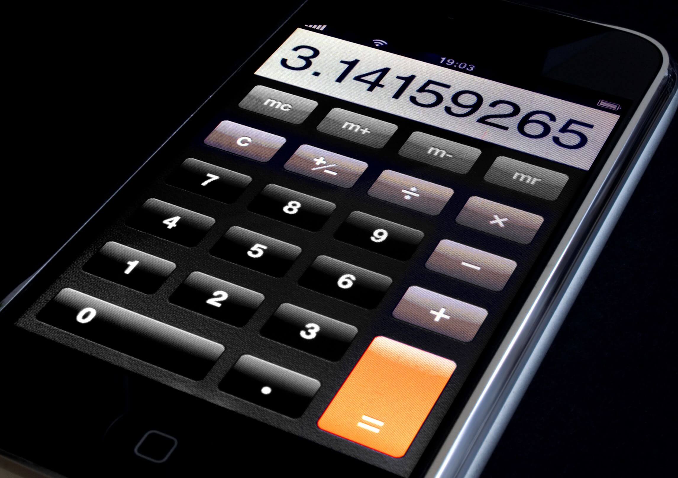 Close-up of digital calculator displaying numbers used for vehicle cost and budget planning